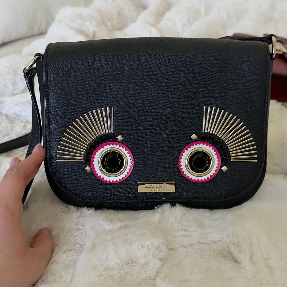 kate spade Black Crossbody Bag with Pink Eye Embellishments